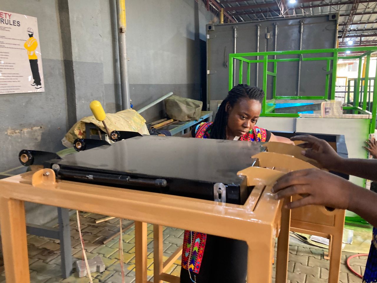 NaturePacks workshop team working on custom process equipment