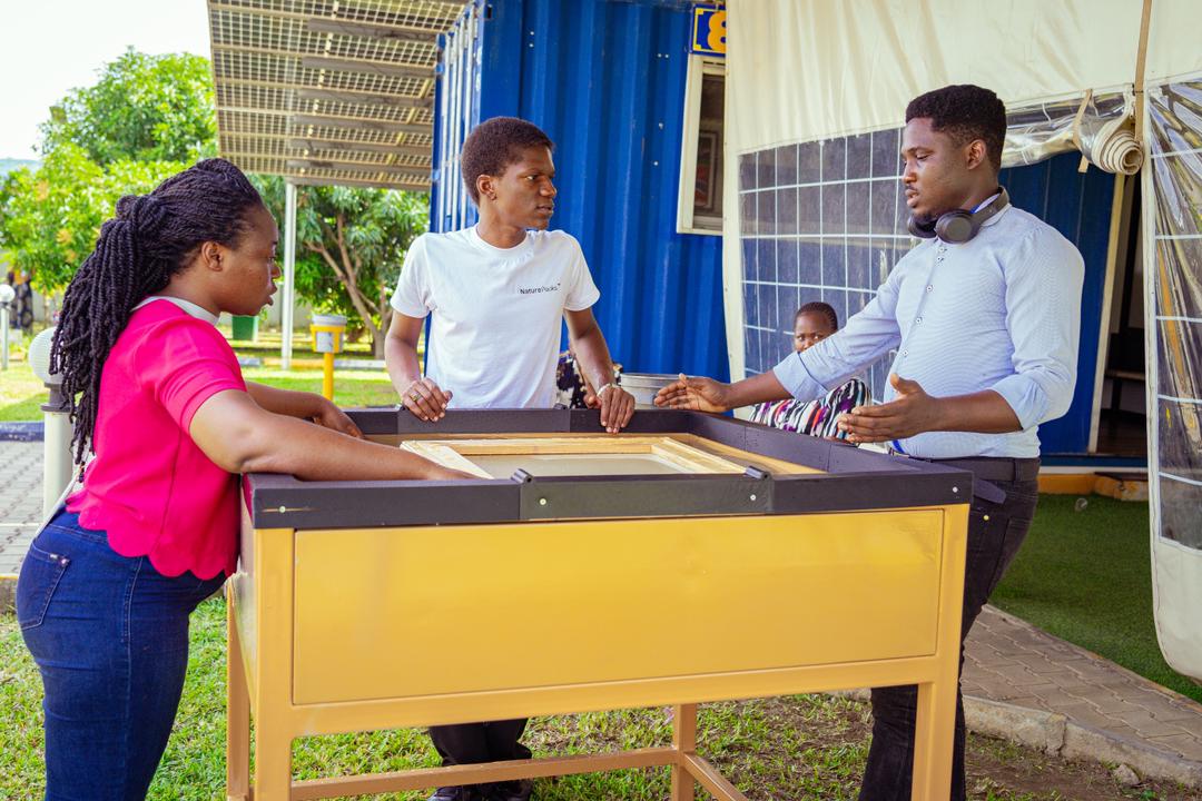 NaturePacks team reviewing the basin and sheet-forming frame
