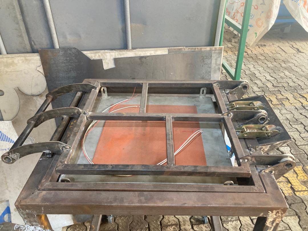 Drying mechanism chassis open showing heating elements and clamp system
